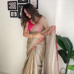 champagne glow tissue saree with hot pink designer border & tassel pallu